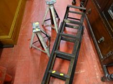 Pair of mechanic's car ramps and white painted axle stands