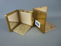 Kigu gold colour lady's compact and one other