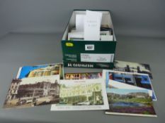 Shoebox of vintage postcards and travel ephemera