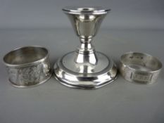 Chester silver squat candlestick and two hallmarked silver napkin rings