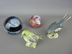 Two vintage glass paperweights and two Beswick pottery birds - grey wagtail and a goldcrest
