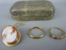 Nine carat gold wedding band, a dress ring with a ruby type leaf setting and a nine carat gold