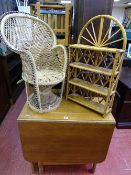 Twin flap dining table with interior cupboard, small basket weave peacock style chair and a bamboo