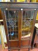 Polished wood two door glazed display cabinet