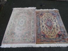 Ffrith Chinese washed floral rug and a cream and blue bordered rug with tasselled ends