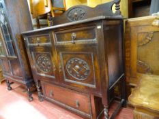 Railback sideboard having twin drawers over twin cupboard doors and a single base drawer
