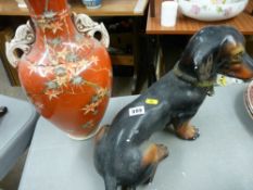 Heavy porcelain dachshund and a narrow necked vase
