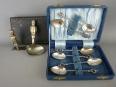 Child's EPNS feeder spoon and pusher set, the handles formed as military guards, five thistle topped