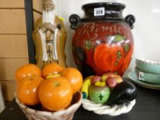 Oriental figure, faux fruit basket ornament and a Rumtopf jar