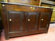 AN ANTIQUE OAK COFFER with iron strap hinges to the top, peg joined panel sides and triple chamfered