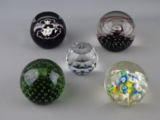 FIVE GLASS PAPERWEIGHTS - one circular blue tinted Swarovski of globe form, a limited edition (23/