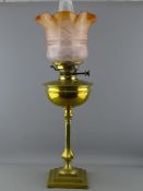 A VICTORIAN BRASS OIL LAMP on a decorative column and stepped square base having Hinks No. 2 lever