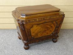 A REGENCY MAHOGANY WINE COOLER of neat proportions with carved and reeded half pillars to canted