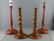 A PAIR OF RED CHINOISERIE STYLE TABLE LAMPS and a pair of barley twist candlesticks, 43 and 36 cms
