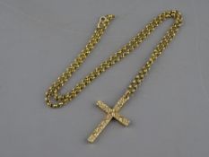 A NINE CARAT GOLD LINK CHAIN with floral decorated nine carat gold crucifix, 21 grms