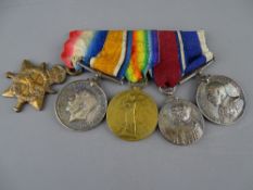 A WORLD WAR I ROYAL NAVY LONG SERVICE GROUP OF FIVE MEDALS awarded to J16038 T E Parry, including