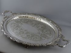 A FENTON BROTHERS LTD TWO HANDLED SILVER PLATED SERVING TRAY, chased decorated centre with shell and