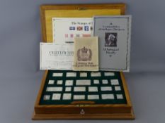 SILVER JUBILEE STAMPS OF ROYALTY - a fine oak encased set of twenty four sterling silver (925)