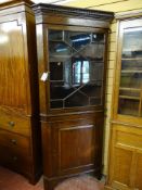 A 19th CENTURY TWO PIECE OAK FLOORSTANDING CORNER CUPBOARD with thirteen panel astragal glazed top