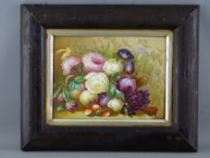 A CONTINENTAL HAND PAINTED PORCELAIN PANEL of fruit and flowers within a rustic wooden frame,