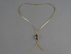 A BELIEVED GOLD BOX STYLE NECKLACE with large purple quartz drop pendant in a crossover mount, 17