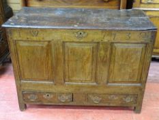 A GEORGE III OAK MULE CHEST, the panelled front initialled 'I W' and dated 1732, with twin lower
