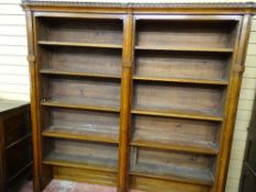 A CIRCA 1900 OAK DOUBLE BOOKCASE having Gothic tracery and adjustable interior shelves, 182 cms
