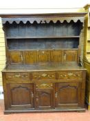 A GEORGE III RARE & FRESH TO THE MARKET SNOWDONIA OAK DRESSER, the canopied rack with decorative