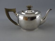 A BACHELOR'S SILVER TEAPOT, London 1917, maker Carrington & Co, with composite handle and lid