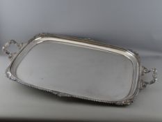 A LARGE RECTANGULAR TWO HANDLED SILVER PLATED SERVING TRAY by Joseph Rodgers & Sons, Sheffield, 74