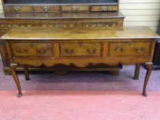 A 19th CENTURY OAK SHROPSHIRE DRESSER BASE, the planked top over three crossbanded and string inlaid