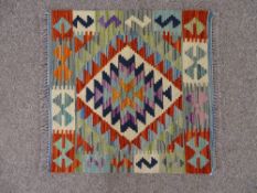 A VEGETABLE DYE WOOL CHOBI KELIM RUG, single zig zag diamond central pattern with short block