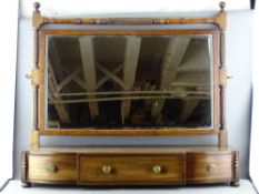 AN EARLY 19th CENTURY MAHOGANY SWING TOILET MIRROR with turned supports on a three drawer base