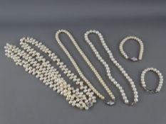A TWIN ROW OF FRESHWATER PEARLS, each row having an alternating double pearl, two cultivated