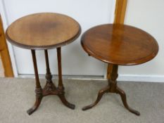 TWO ANTIQUE MAHOGANY CIRCULAR TOPPED SIDE TABLES, one having a tilt top on a tripod base, the