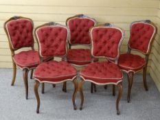 A GOOD SET OF FIVE MAHOGANY SIDE CHAIRS with carved floral detail to the top rail, wine colour