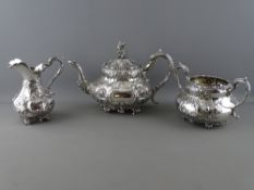 A VICTORIAN THREE PIECE SILVER TEASET, Sheffield 1855, 48.9 troy ozs gross, highly decorative with