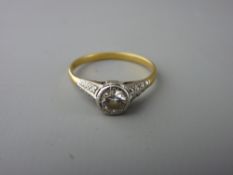 A BELIEVED EIGHTEEN CARAT GOLD DIAMOND SET RING, the approximate half carat central stone on