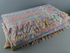 A TRADITIONAL STYLE WELSH WOOLLEN BLANKET with repeating patterns in pink and blue tones, 196 x