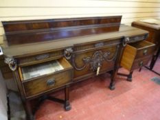 A GOOD QUALITY GILLOWS, LANCASTER MAHOGANY RAILBACK SIDEBOARD with ram's head and leaf swag