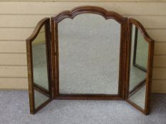 A QUALITY WALNUT FRAMED TRIPLE DRESSING MIRROR with shaped top detail, 71.5 cms maximum height, 53