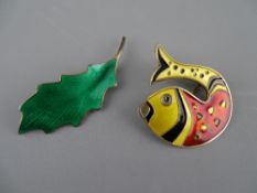 TWO NORWAY SILVER & ENAMEL BROOCHES by David Andersen and Karl A Rasmunssen, in leaf and fish form