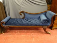 A VICTORIAN EMPIRE STYLE CHAISE LONGUE, mahogany framed with blue plush upholstery, scroll ends