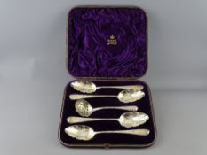 A FINE CASED SET OF FOUR GEORGIAN SILVER FRUIT SERVING SPOONS with matching sifter, all with gilt