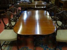 A GARNETT & SONS SET OF SIX (FIVE PLUS ONE) SHIELDBACK MAHOGANY HEPPLEWHITE STYLE DINING CHAIRS