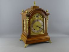 A FINE WINTERHALDER & HOFMEIER CLOCK having an arched top, brass dial plate and gilt metal spandrels