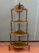 A VICTORIAN WALNUT FOUR SHELF CORNER WHATNOT having burr walnut shaped shelves with twist finial