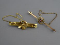 A FIFTEEN CARAT GOLD TWIN BAR & FLORAL BROOCH, 3.7 grms and a nine carat gold bar brooch with seed