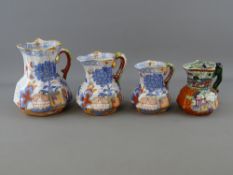 A SET OF THREE GRADUATED MASONS PATENT IRONSTONE JUGS and one other having decorations in the