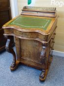 A VICTORIAN WALNUT DAVENPORT, stationery cabinet top with brass three quarter rail and fitted